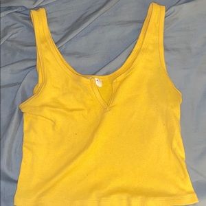 yellow sleeveless crop top